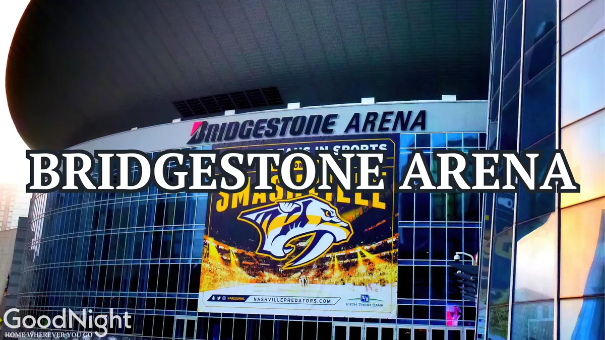 The modern exterior of Bridgestone Arena, featuring large signage and a Nashville Predators banner, bustling with activity. The architecture sets an exciting urban scene connected to sports and entertainment.